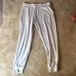 Medium stars above grey sweatpants